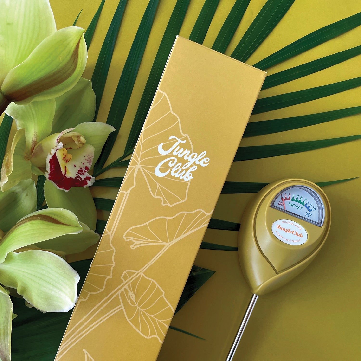 A chartreuse moisture meter with a rounded head and a white meter that ranges from dry, moist, or wet along with a small oval label in the front that reads, "Jungle Club".