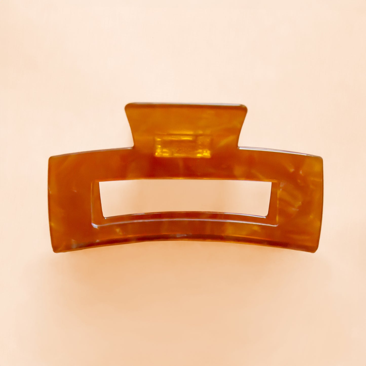 A light brownish orange rectangle hair claw clip.