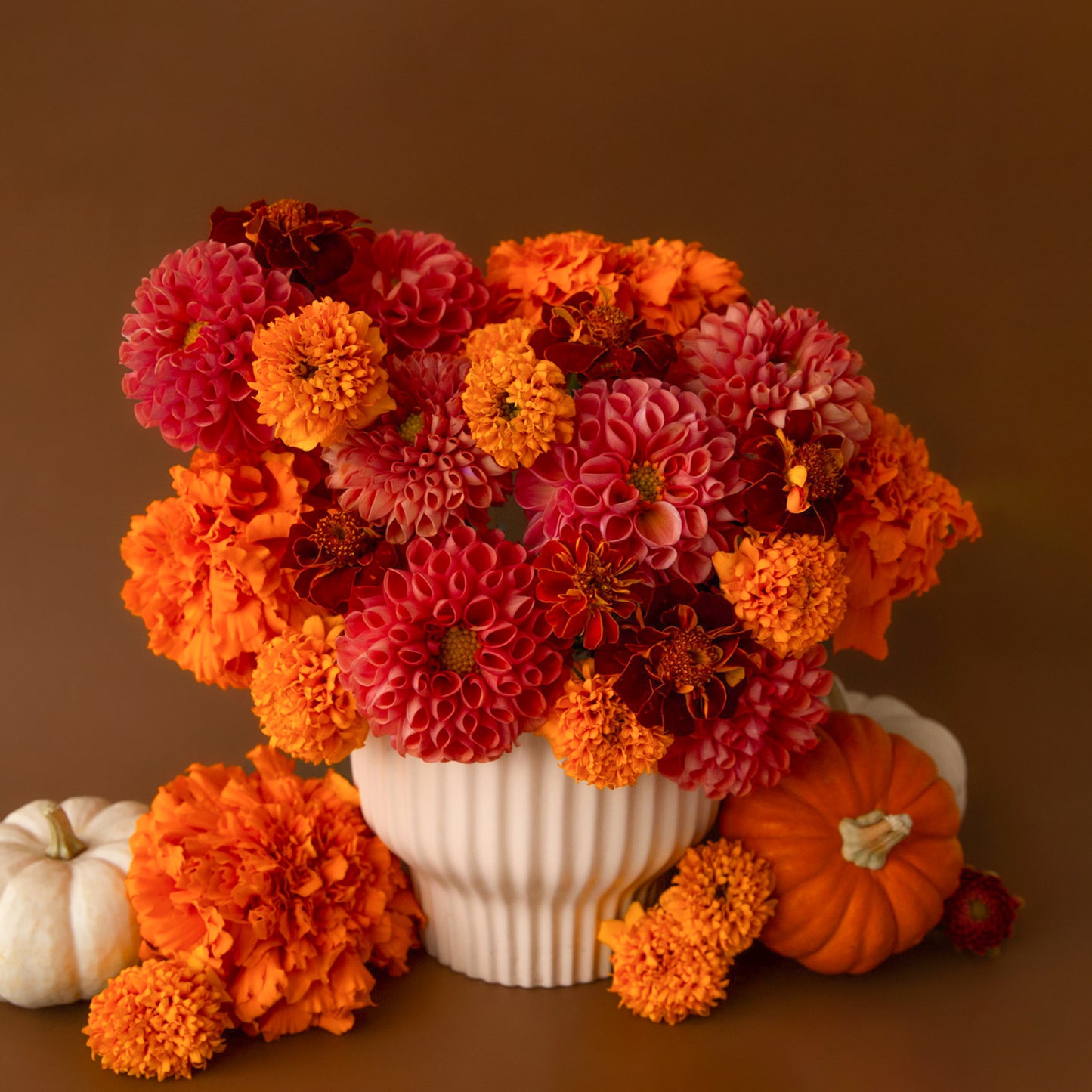 A white ribbed pedestal planter